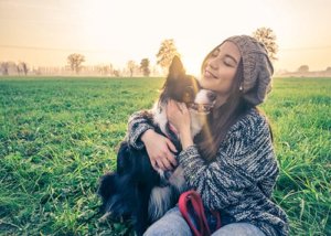 woman playing with a dog anxiety treatment center behavioral health data
