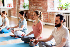A group of people participate in meditation therapy for anxiety disorders